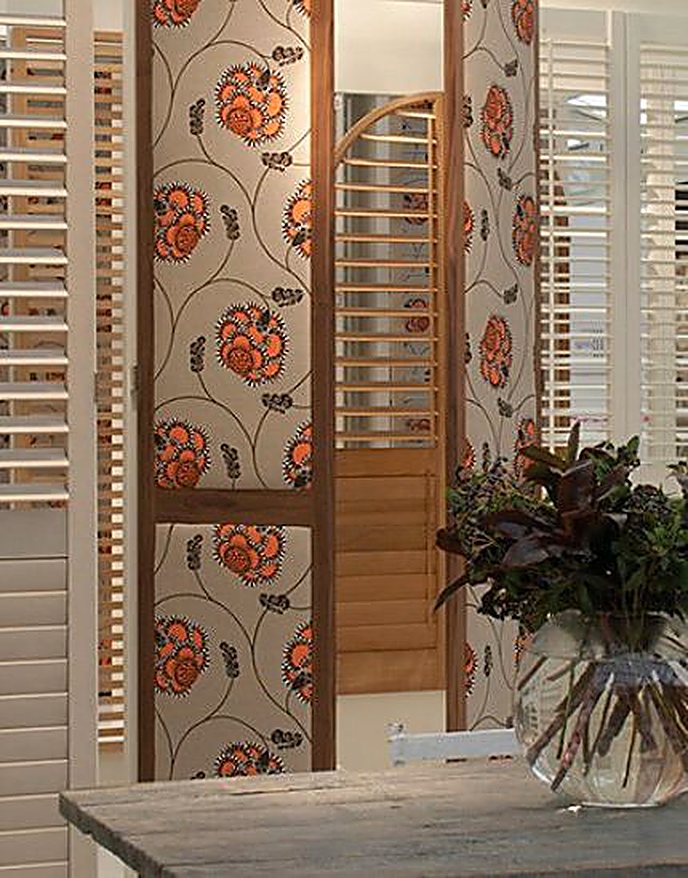 Limed wax finished shutter room divider with floral panels